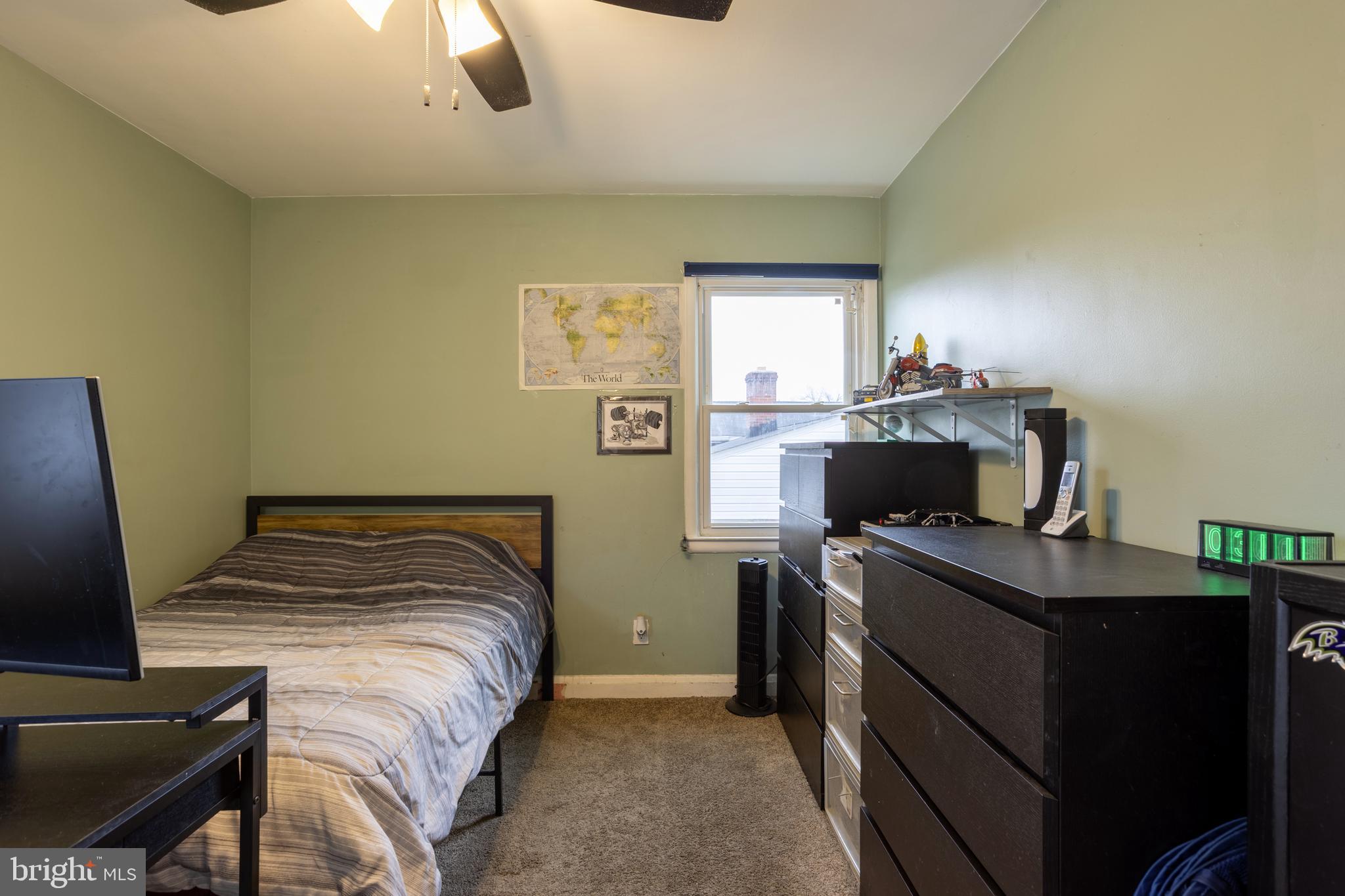 3215 Northbrook Road Baltimore, MD 21208 - Photo 28 of 50 a bedroom with a bed and a desk