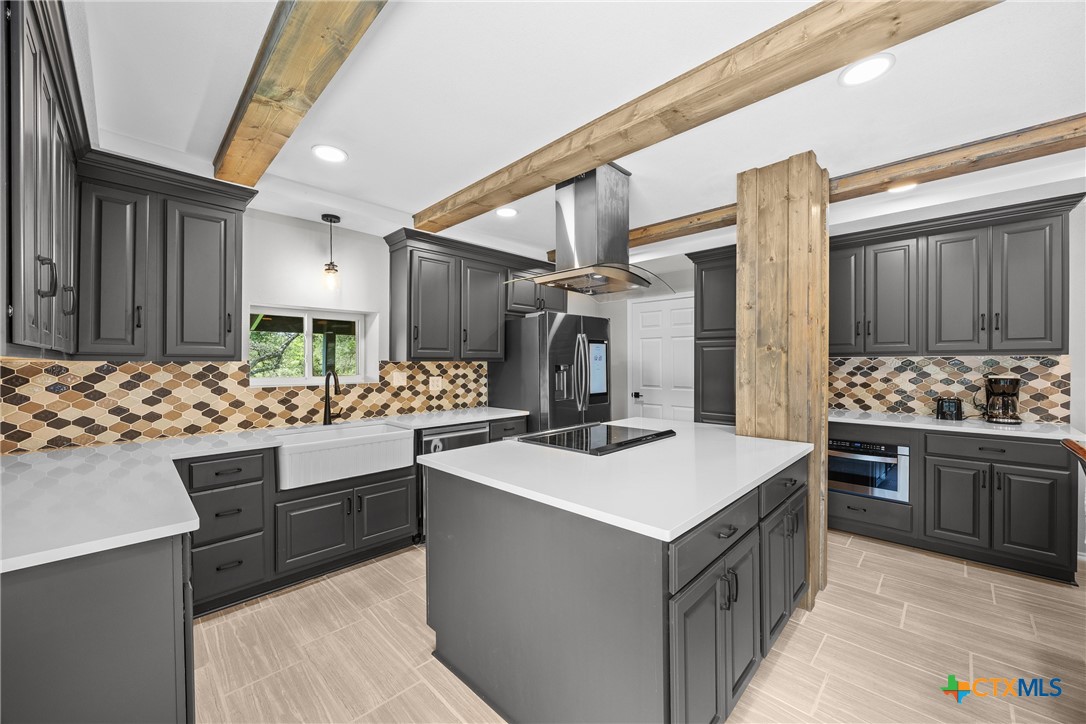 115 Spotted Fawn Gatesville, TX 76528 - Photo 11 of 38 a kitchen that has a sink and a stove in it
