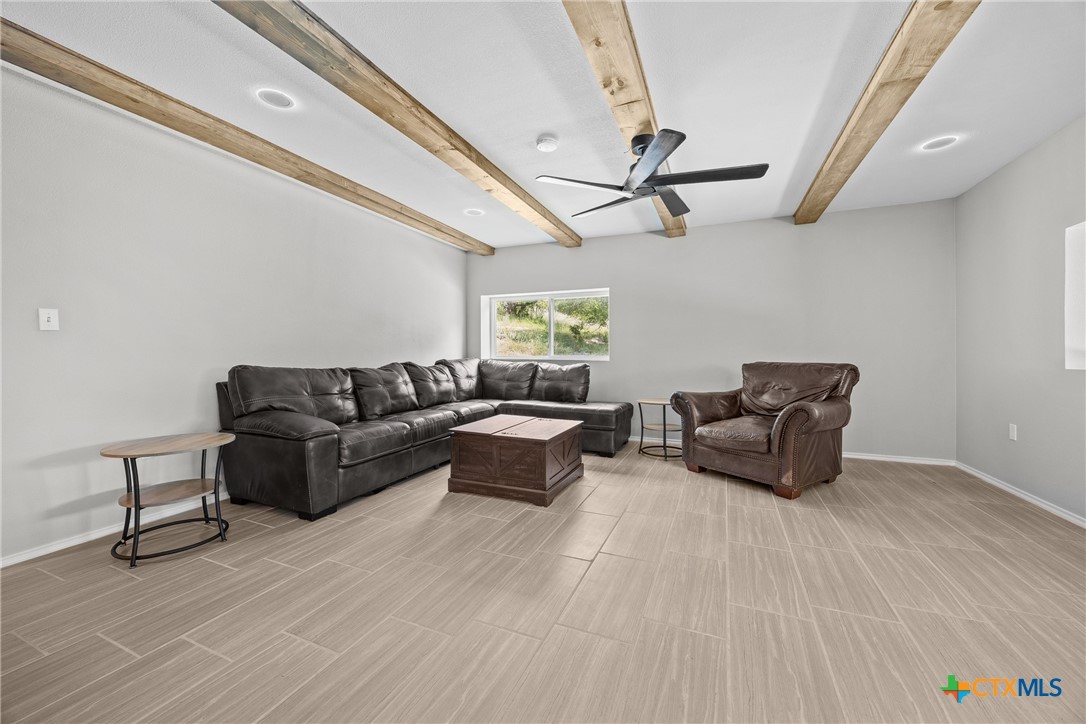 115 Spotted Fawn Gatesville, TX 76528 - Photo 16 of 38 a living room with furniture and a ceiling fan