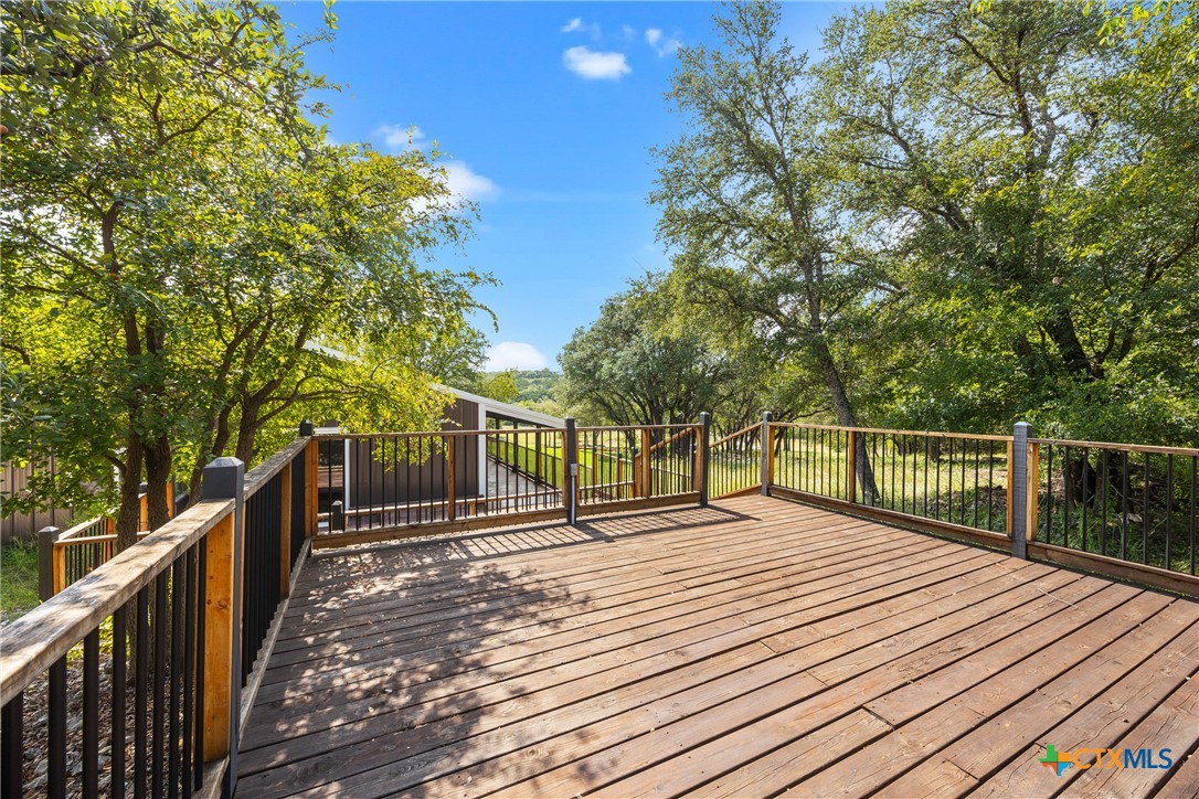 115 Spotted Fawn Gatesville, TX 76528 - Photo 9 of 38 a balcony with wooden floor and fence