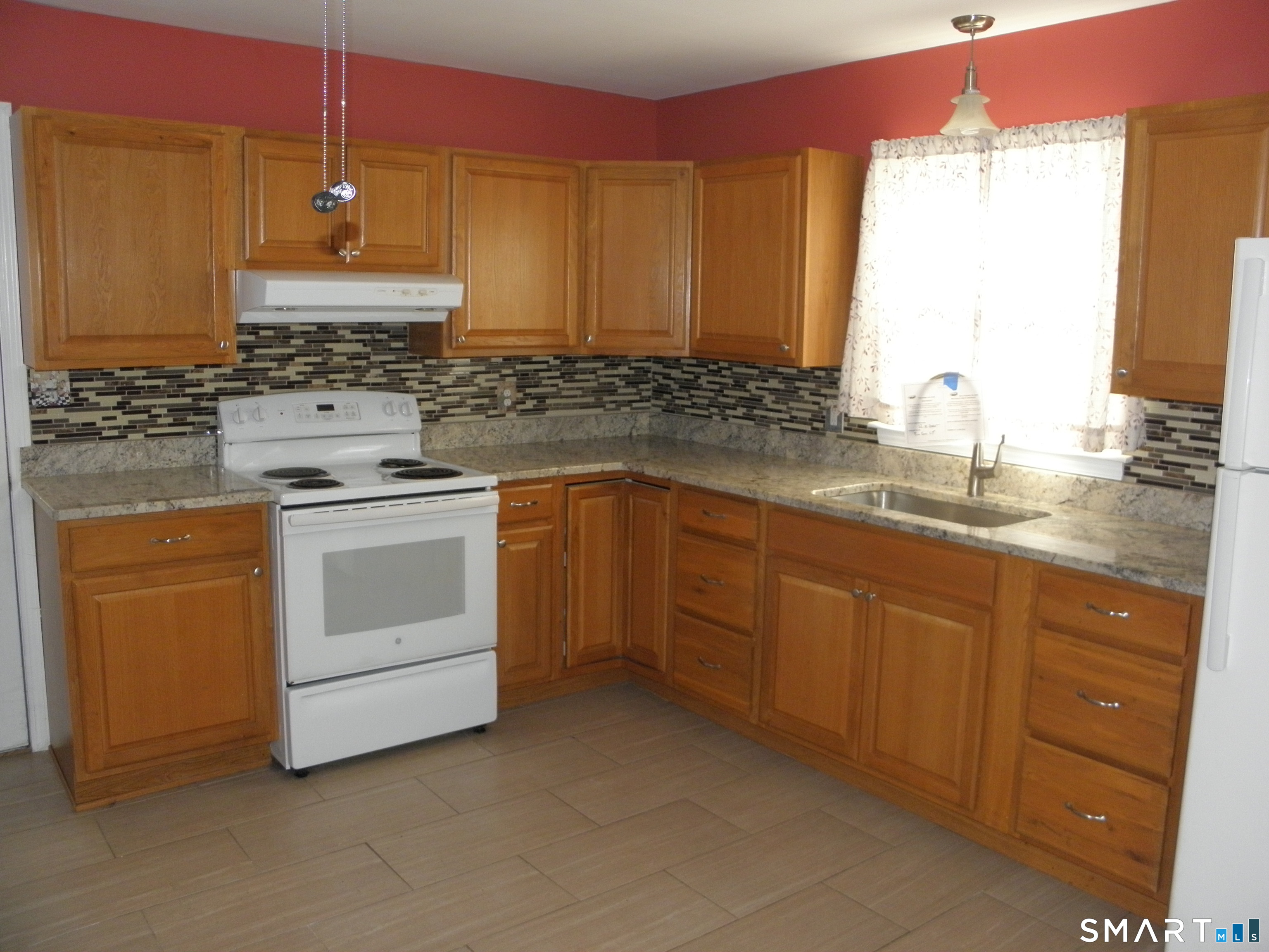 32 Walnut Circle Windsor Locks, CT 06096 - Photo 7 of 11 a kitchen with sink a stove and cabinets