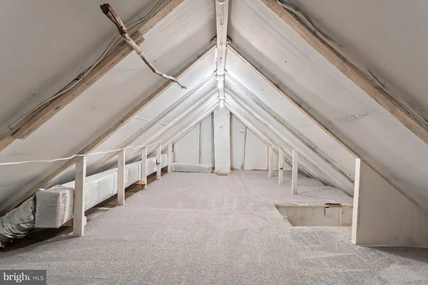 a view of an entryway with a white building