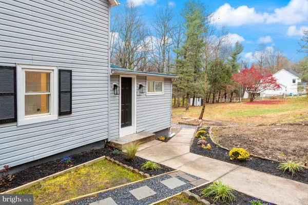 a view of a patio with a table and chairs and wooden floor