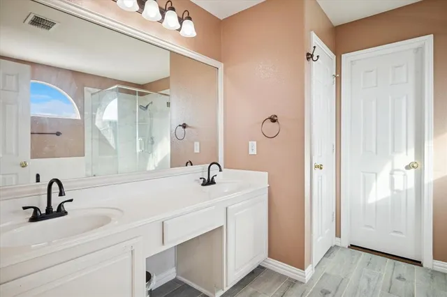 a bathroom with a sink and mirror