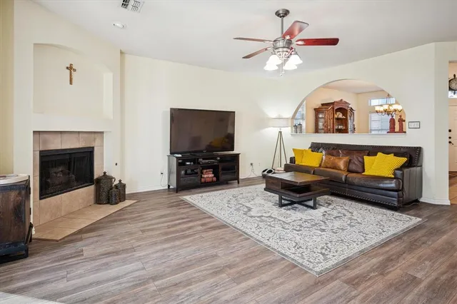 a living room with furniture and a fireplace