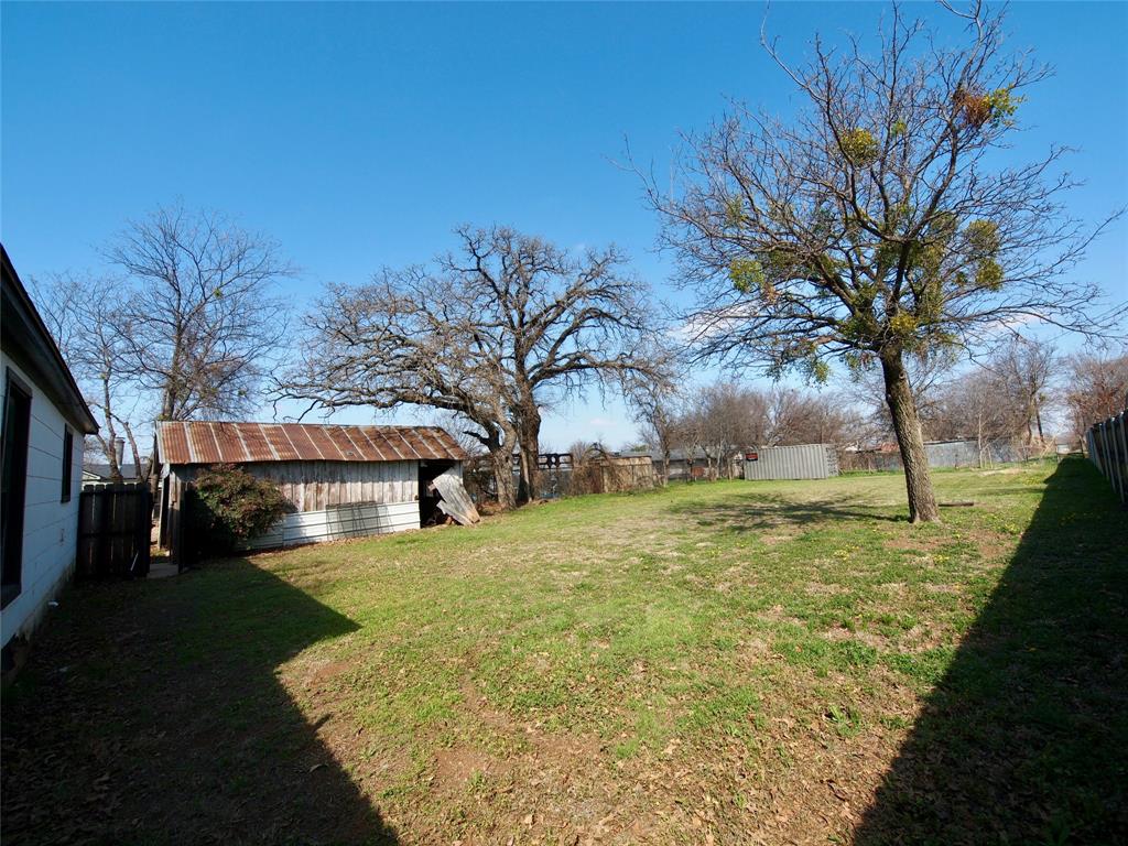 1327 Old Jacksboro Road Graham, TX 76450 - Photo 21 of 33 a view of a yard with an trees