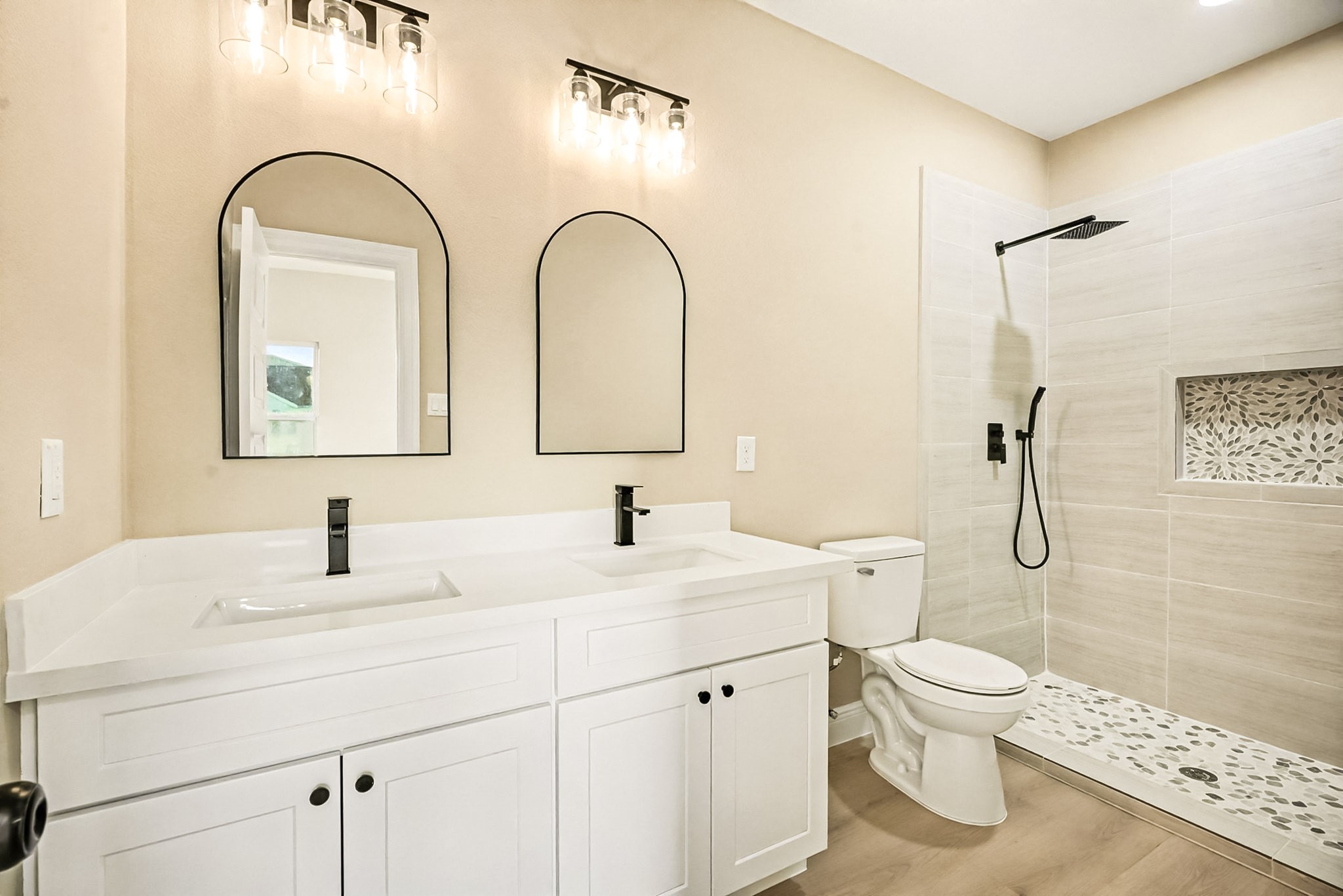 2008 Bellview Street La Marque, TX 77568 - Photo 14 of 17 a bathroom with a double vanity sink toilet and a mirror