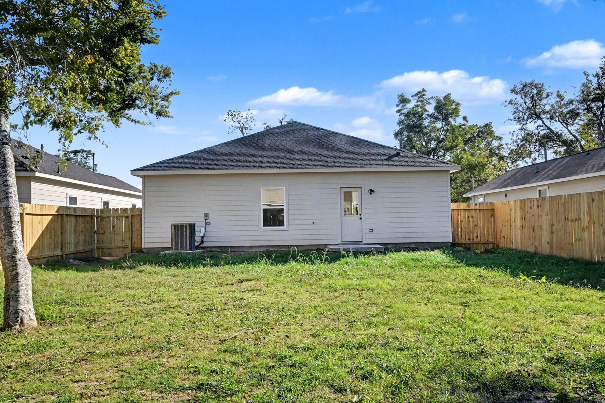 2008 Bellview Street La Marque, TX 77568 - Photo 3 of 17 a backyard of a house with plants and large tree