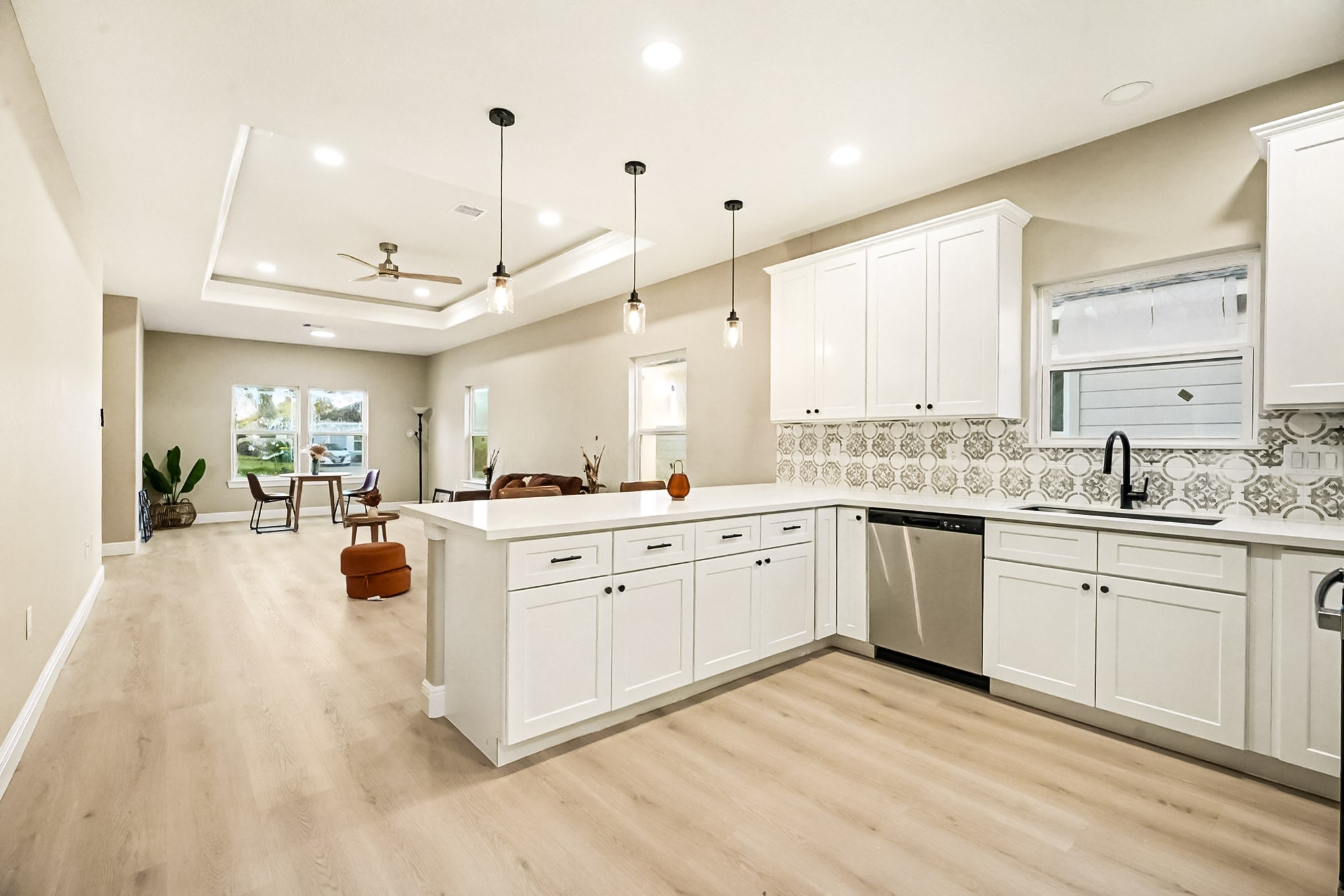 2008 Bellview Street La Marque, TX 77568 - Photo 10 of 17 a large white kitchen with sink and cabinets