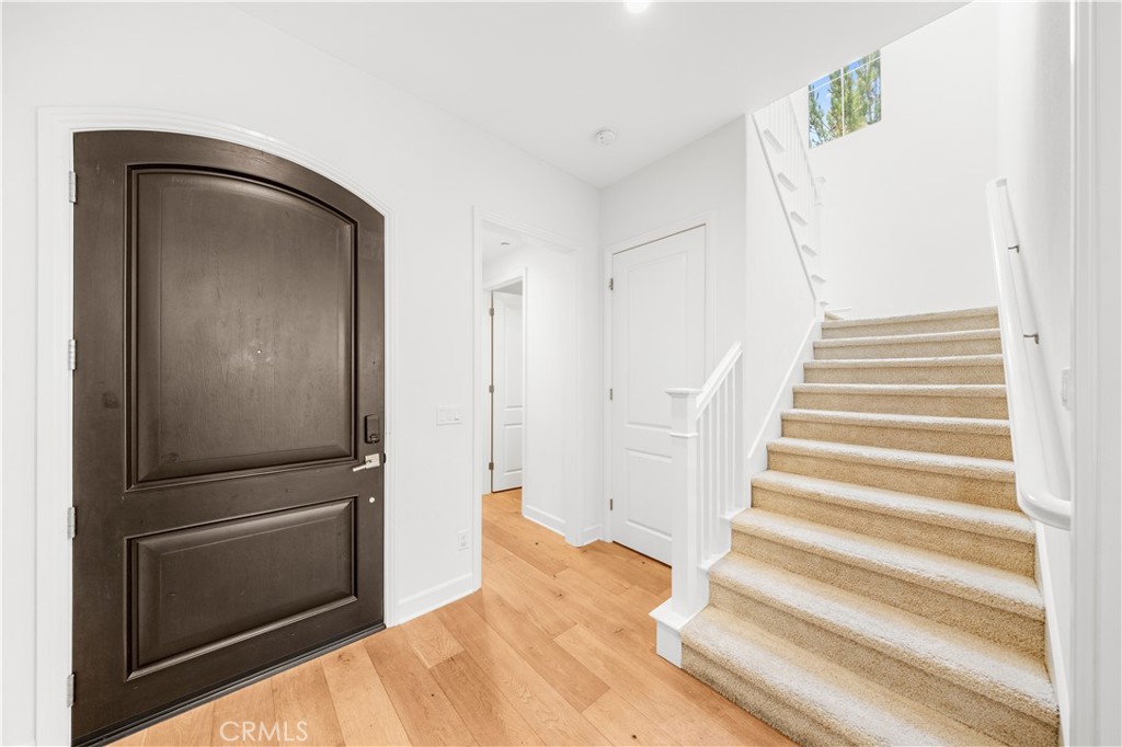 61 Belfast Irvine, CA 92620 - Photo 14 of 24 a view of a closet area with staircase