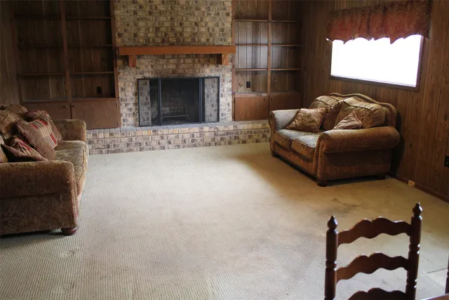 a view of a livingroom with furniture and window