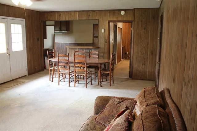 a view of a livingroom with furniture and window