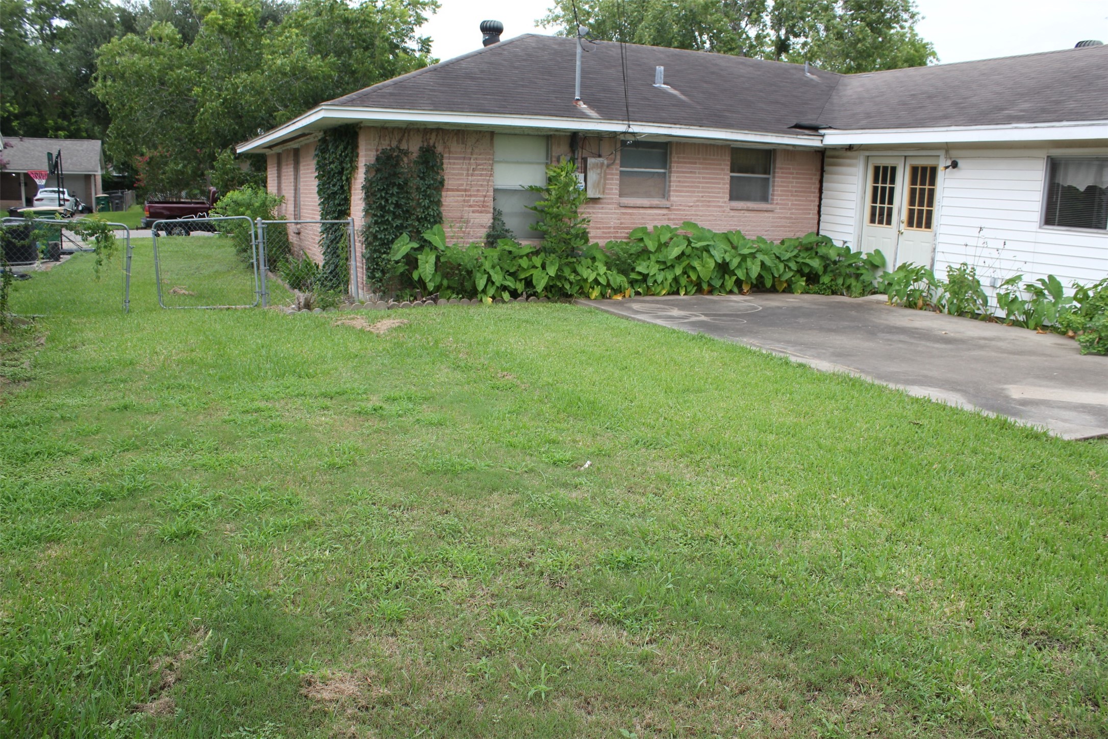 1610 Bexar Avenue Victoria, TX 77901 - Photo 8 of 30 a view of a house with a yard and potted plants