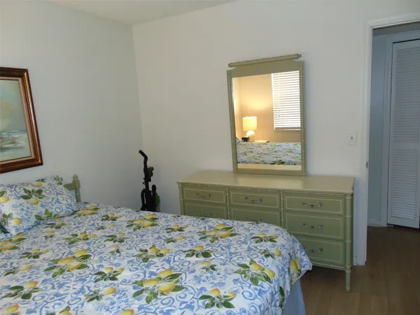 a bedroom with a bed and a cabinets