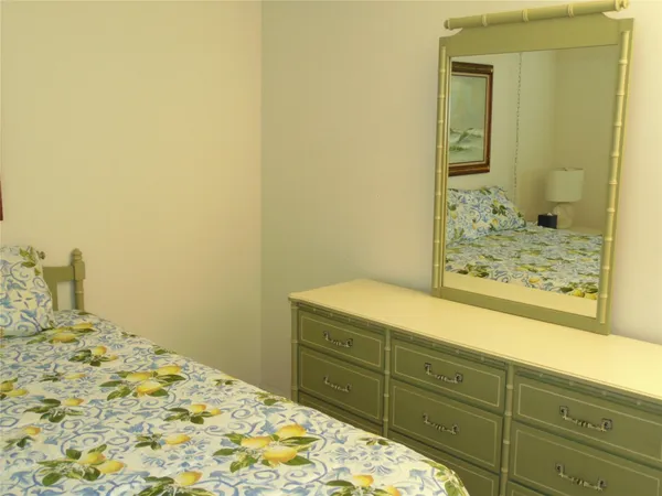 a bathroom with a shower and a mirror