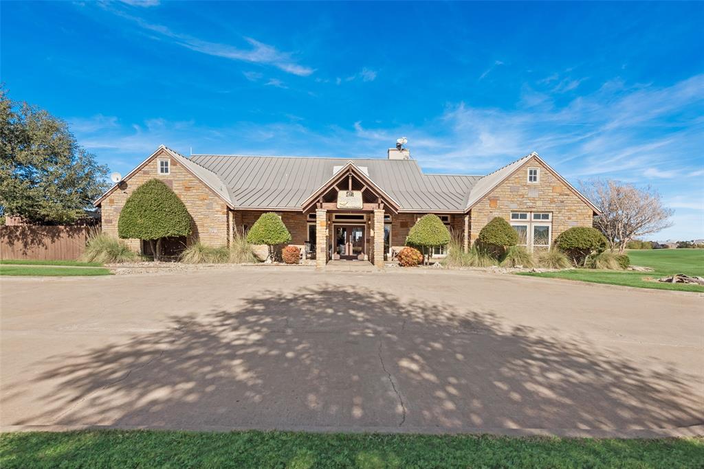 50 Jupiter Drive Graford, TX 76449 - Photo 11 of 14 a front view of a house with a yard and garage