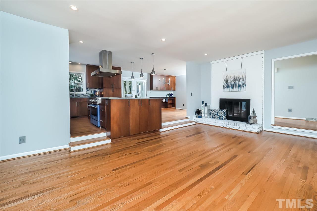 6233 Rushingbrook Drive Raleigh, NC 27612 - Photo 12 of 12 Open floor plan with plenty of place for entertaining. Notice the island storage!