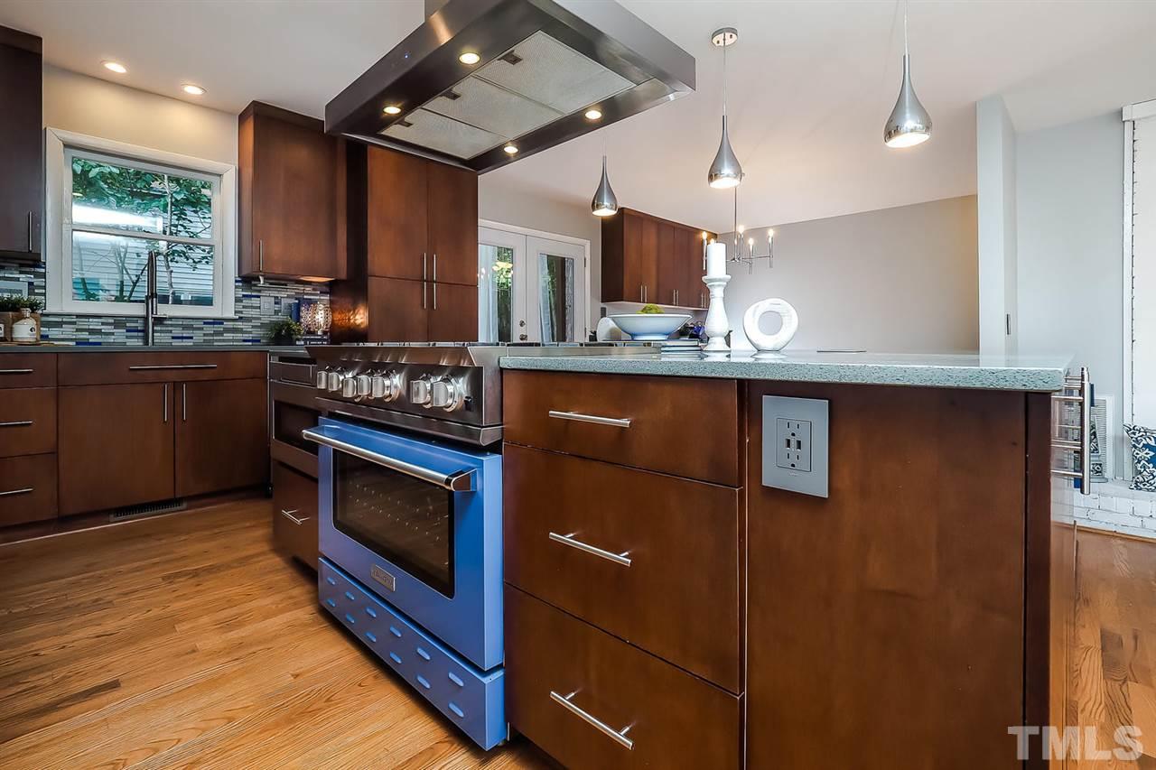 6233 Rushingbrook Drive Raleigh, NC 27612 - Photo 3 of 12 DREAM kitchen for anyone who likes to cook! The high-end range offers 6 large burners.