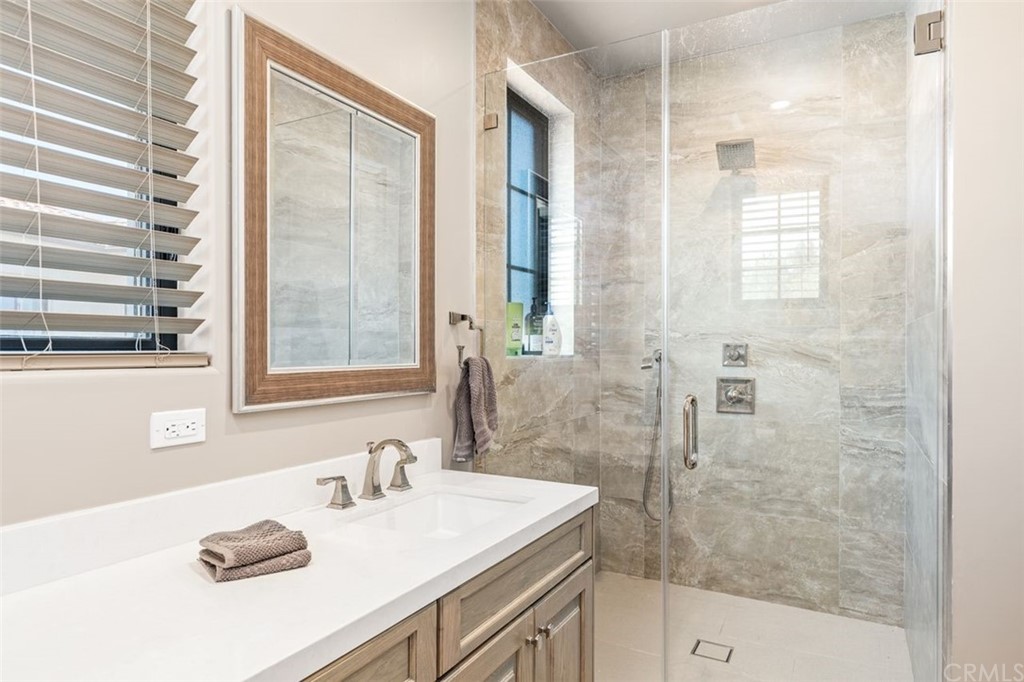 19 Alexa Lane Ladera Ranch, CA 92694 - Photo 14 of 40 a bathroom with a sink and a shower