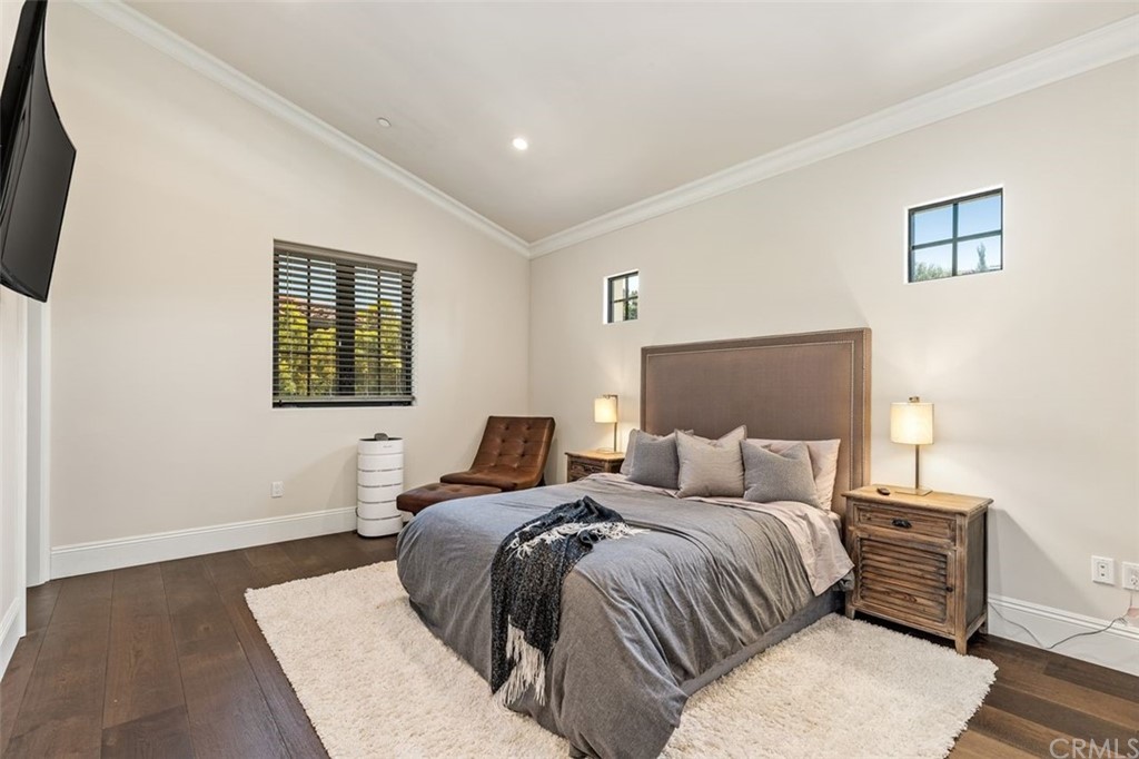 19 Alexa Lane Ladera Ranch, CA 92694 - Photo 17 of 40 a bedroom with a bed and wooden floor