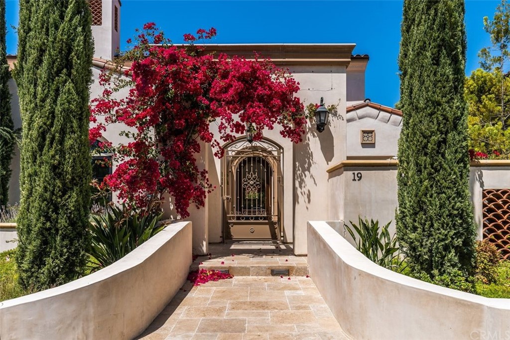 19 Alexa Lane Ladera Ranch, CA 92694 - Photo 2 of 40 a front view of a house with a bunch of flowers