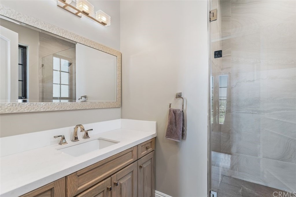 19 Alexa Lane Ladera Ranch, CA 92694 - Photo 25 of 40 a bathroom with a sink and a mirror