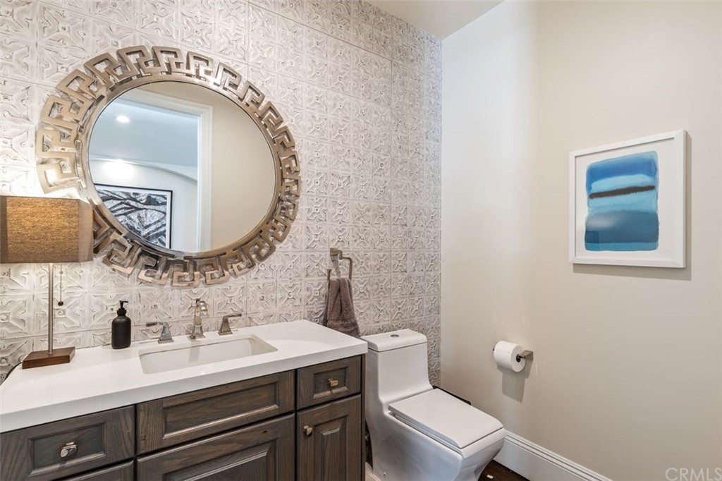 19 Alexa Lane Ladera Ranch, CA 92694 - Photo 27 of 40 a bathroom with a toilet a sink and a mirror