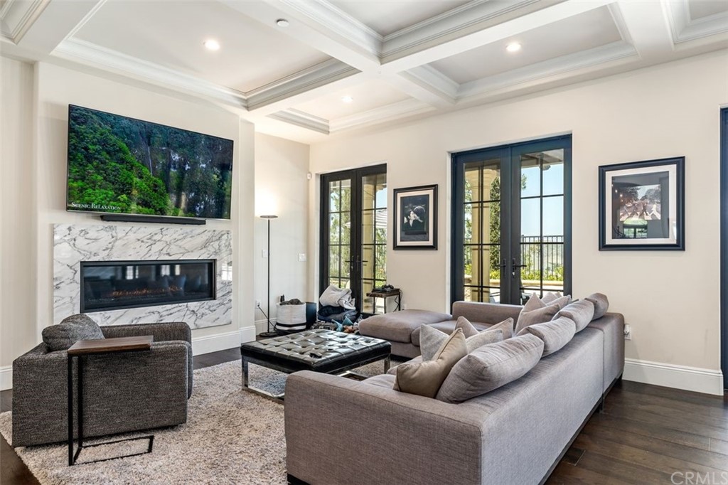 19 Alexa Lane Ladera Ranch, CA 92694 - Photo 38 of 40 a living room with fireplace furniture and a flat screen tv