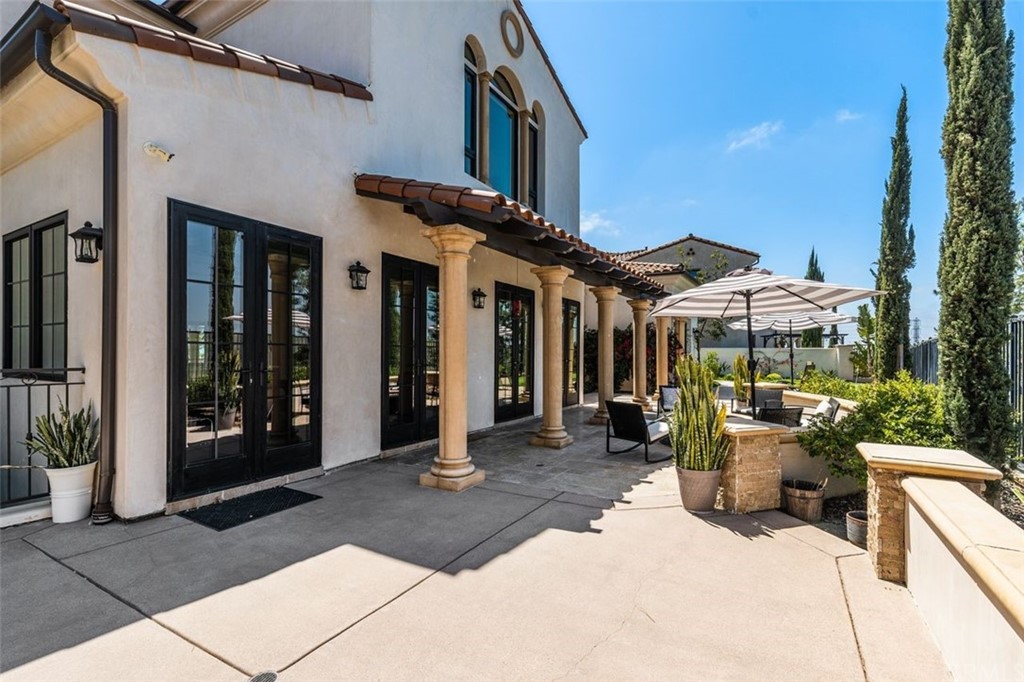 19 Alexa Lane Ladera Ranch, CA 92694 - Photo 8 of 40 a view of a patio with table and chairs and potted plants