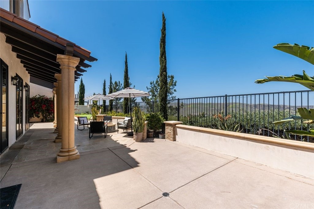 19 Alexa Lane Ladera Ranch, CA 92694 - Photo 9 of 40 a view of a patio with a table and chairs