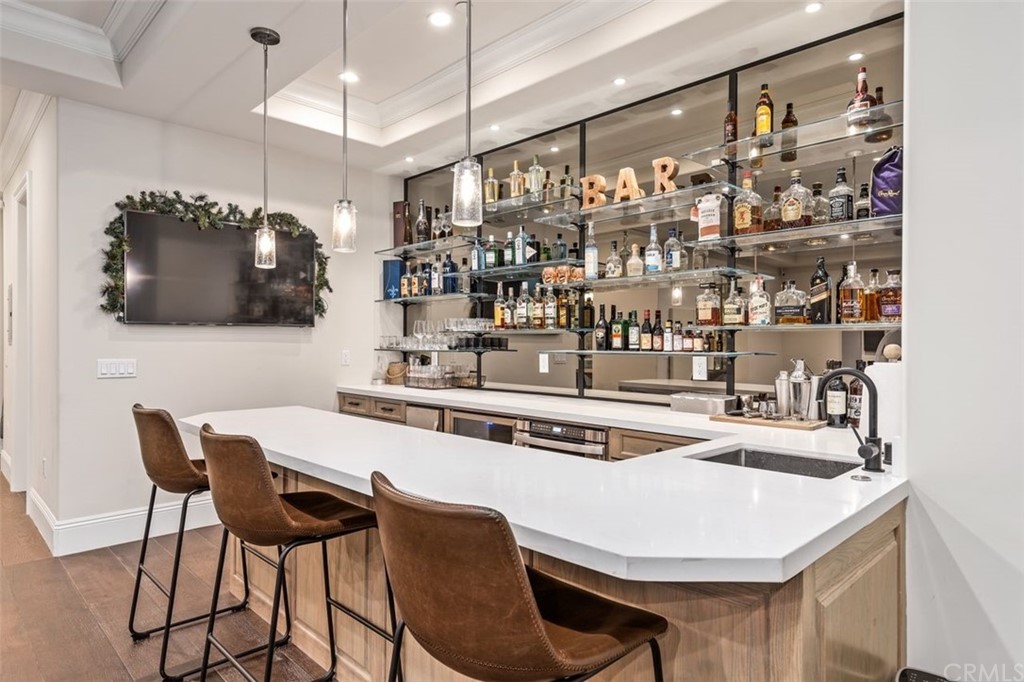 19 Alexa Lane Ladera Ranch, CA 92694 - Photo 10 of 40 a white kitchen with a table and chairs in it