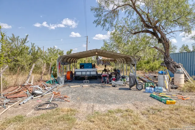 a view of a chairs and tables in the patio