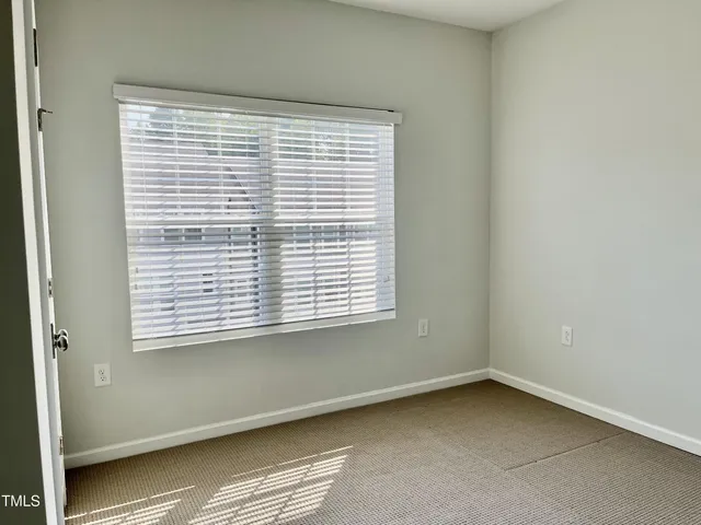 a view of a room that has a window in it