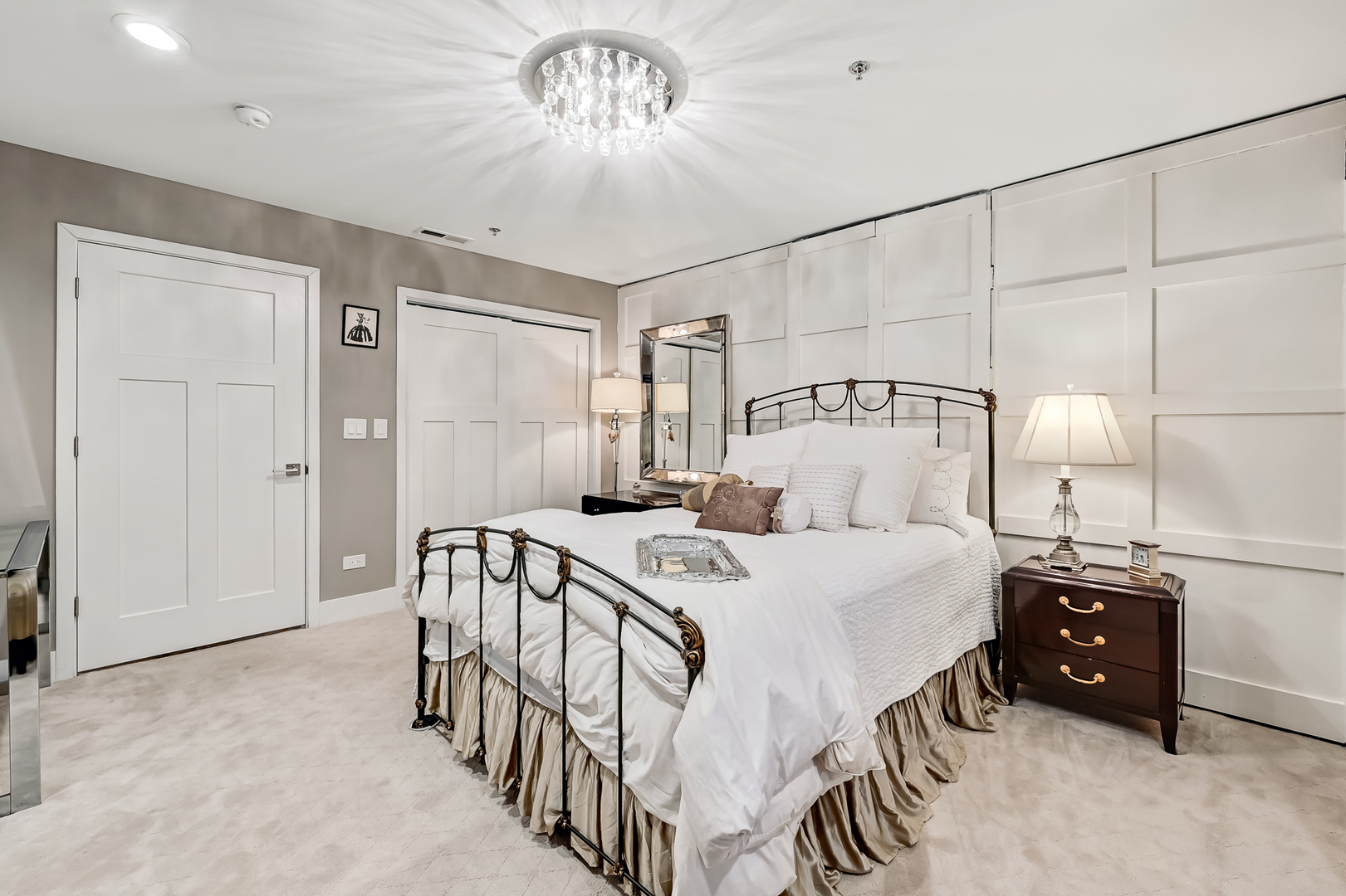 1140 Old Mill Road, Unit 101F Hinsdale, IL 60521 - Photo 11 of 14 a bedroom with a bed and a chandelier
