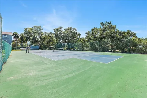 a view of a swimming pool with a yard