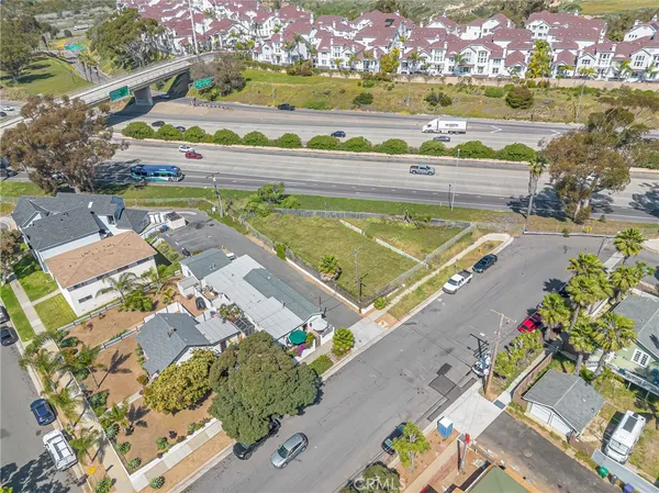 an aerial view of residential houses with outdoor space