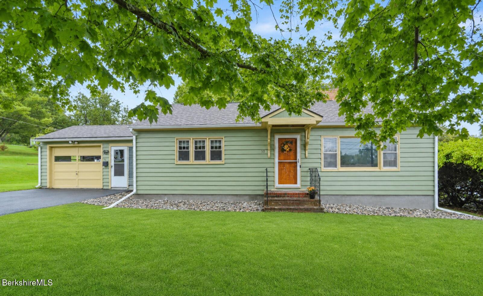16 Anthony Street Adams, MA 01220 - Photo 2 of 33 a front view of a house with a garden