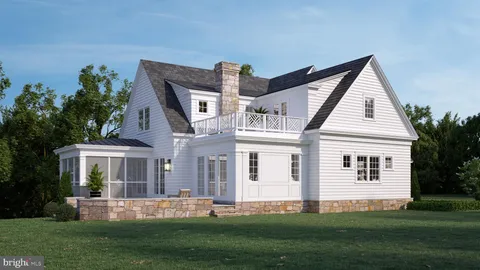 a front view of a house with a garden and yard