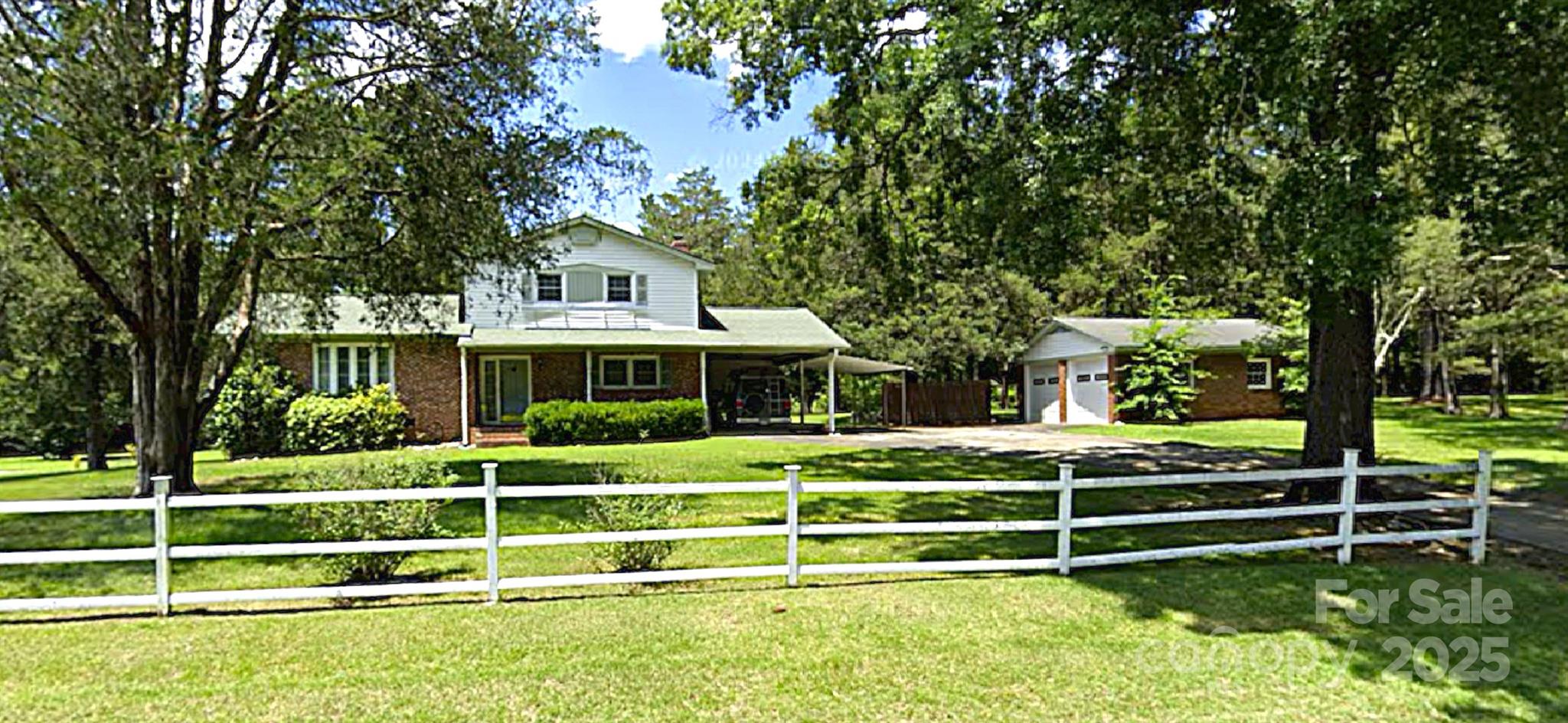 752 Cedar Lane Chester, SC 29706 - Photo 1 of 38 a front view of a house with a garden