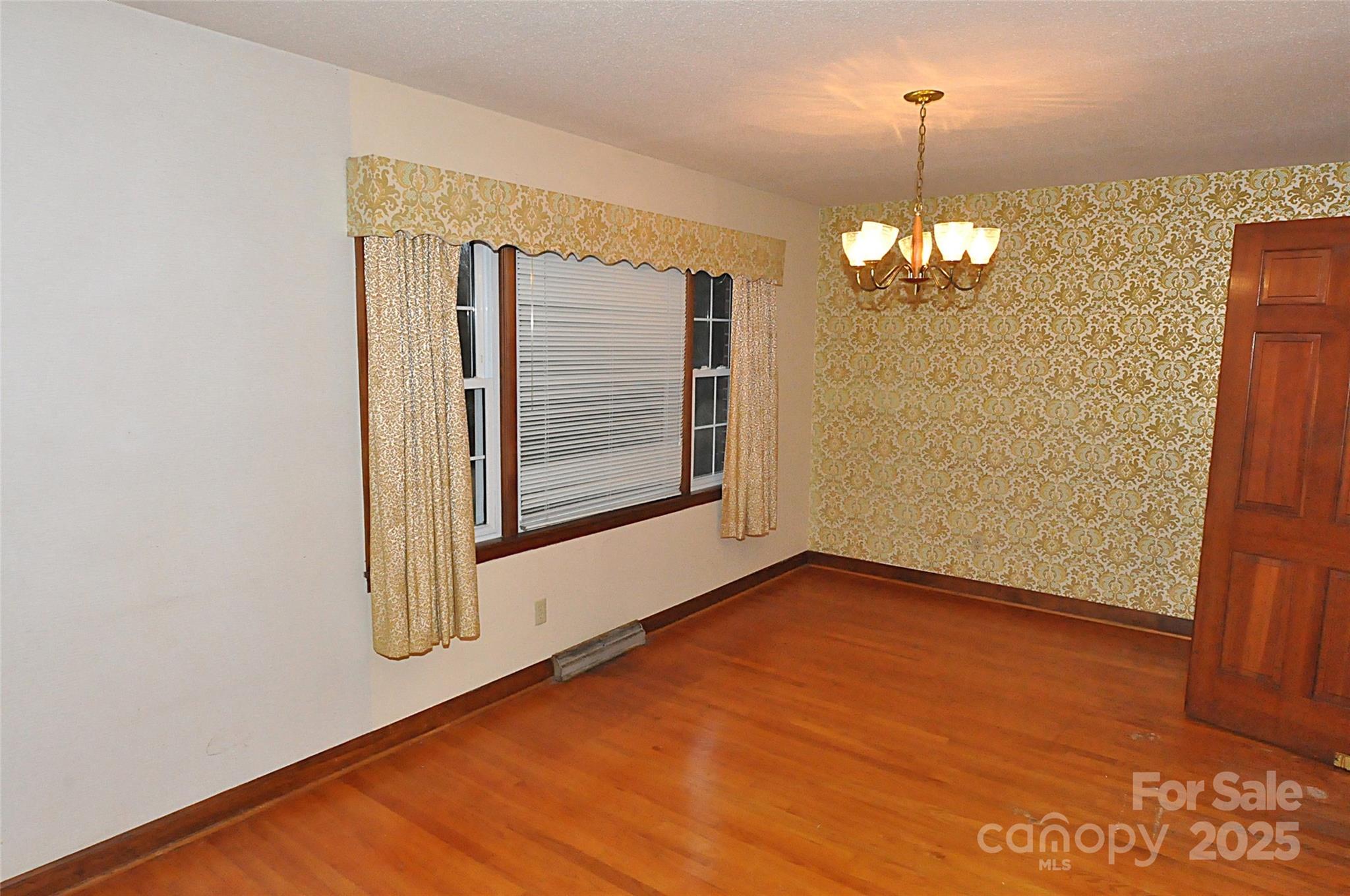 752 Cedar Lane Chester, SC 29706 - Photo 12 of 38 a view of an empty room with chandelier and glass door