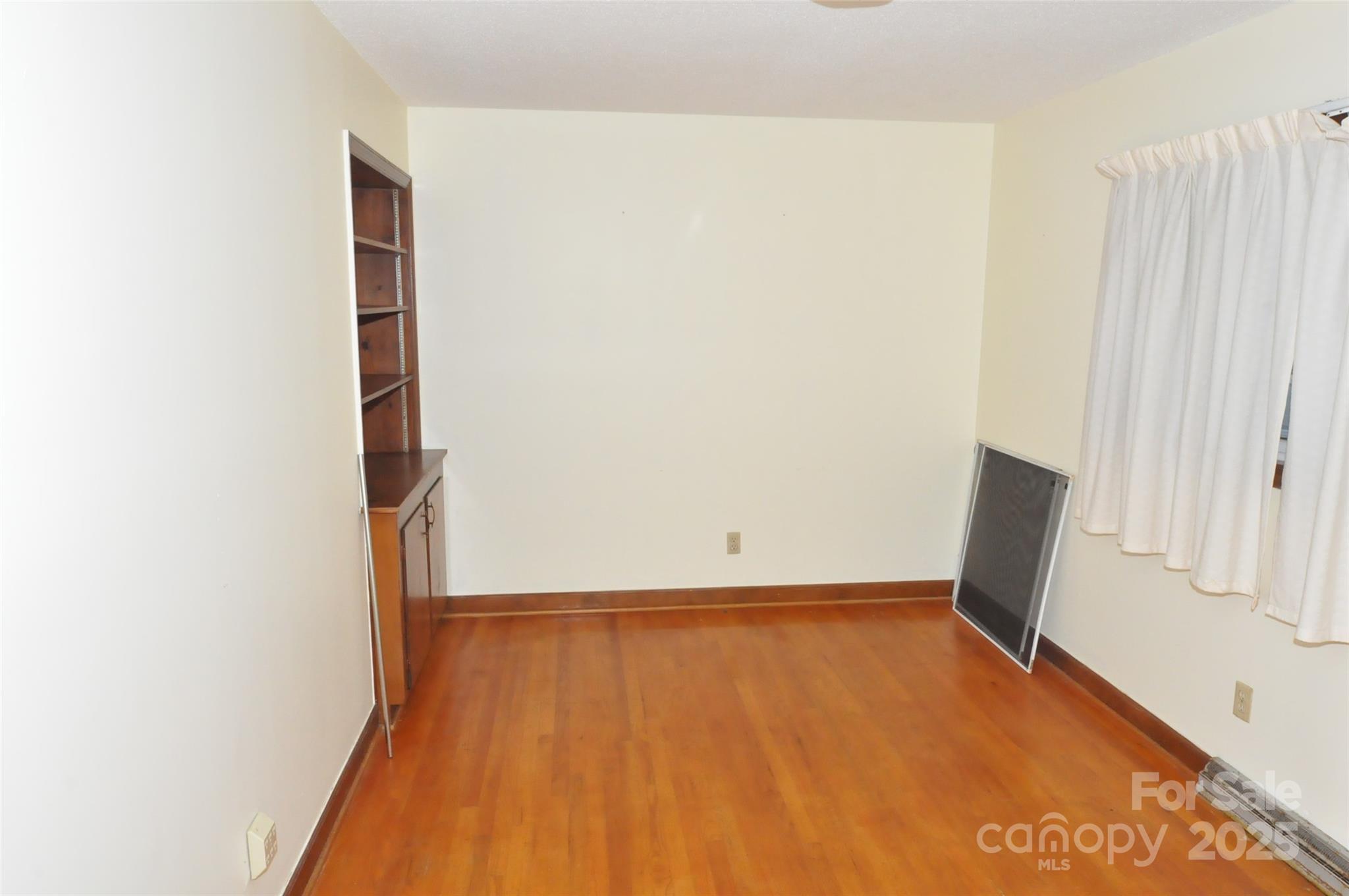 752 Cedar Lane Chester, SC 29706 - Photo 13 of 38 a view of a room with wooden floor and white walls