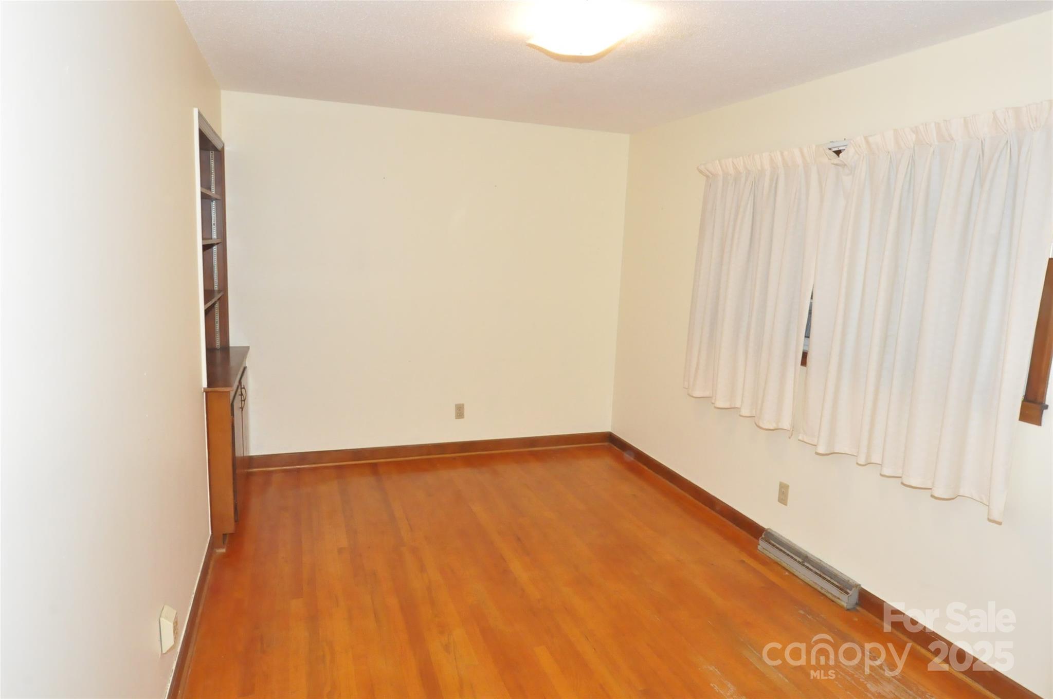 752 Cedar Lane Chester, SC 29706 - Photo 13 of 35 a view of a room with wooden floor and cabinet