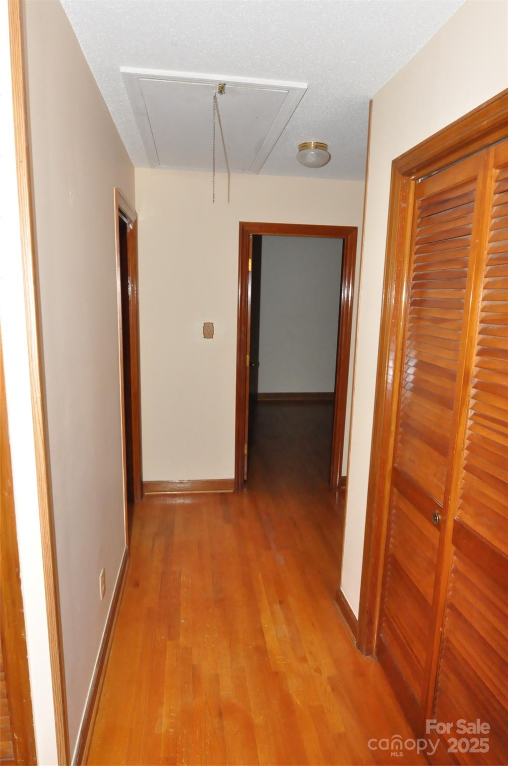752 Cedar Lane Chester, SC 29706 - Photo 27 of 38 a view of hallway with stairs and wooden floor