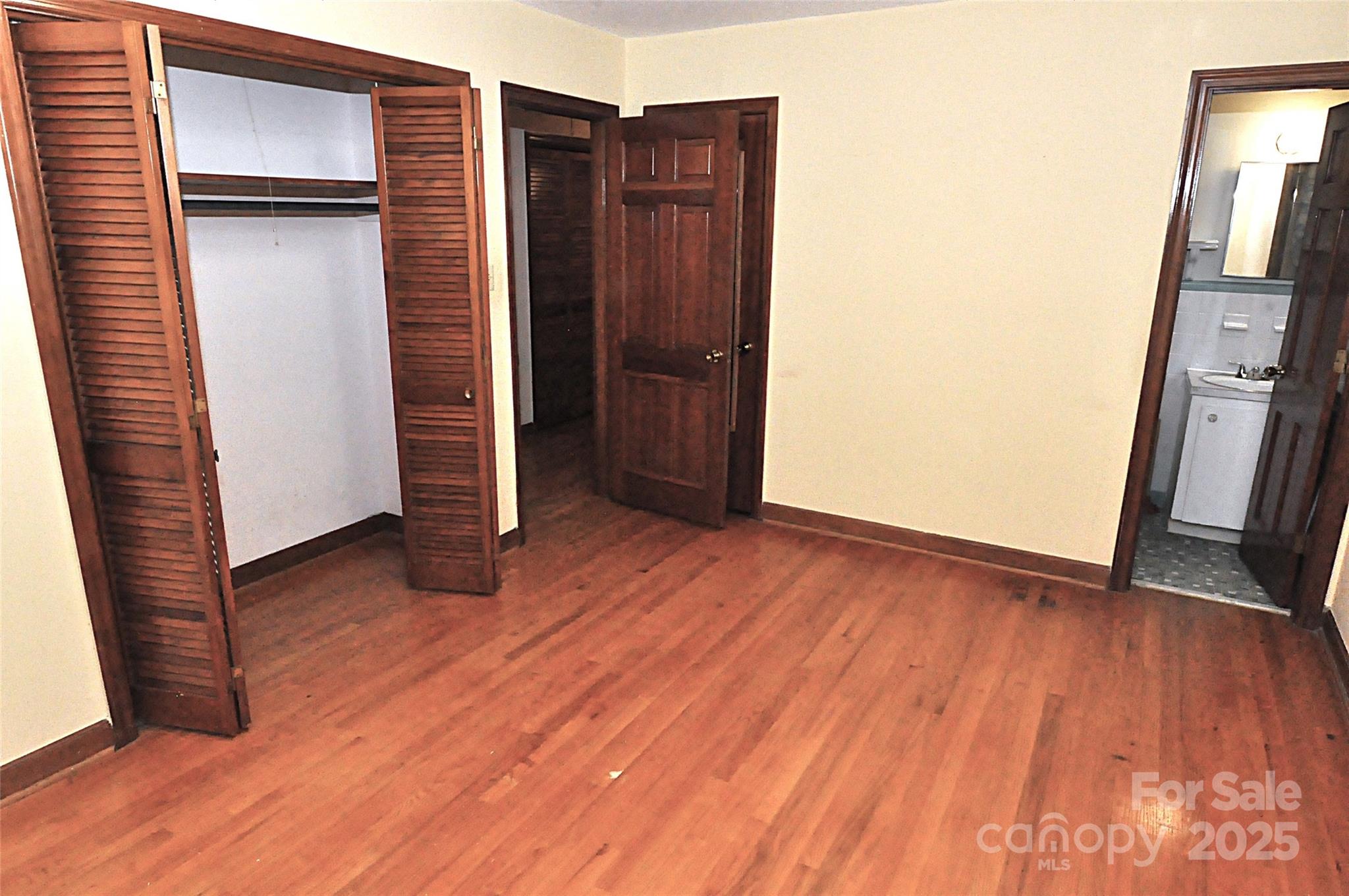 752 Cedar Lane Chester, SC 29706 - Photo 30 of 35 an empty room with wooden floor and closet