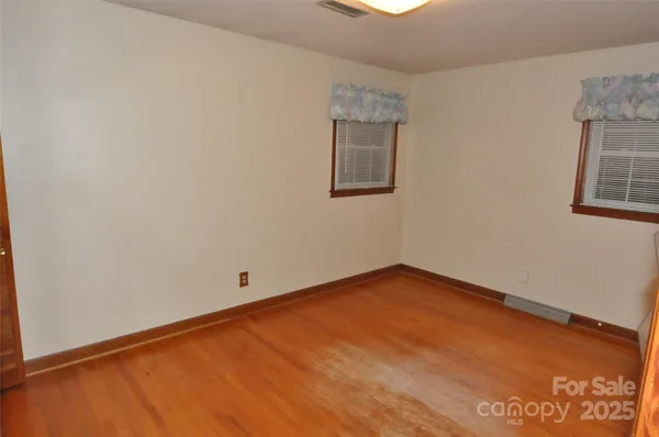 a view of empty room with windows
