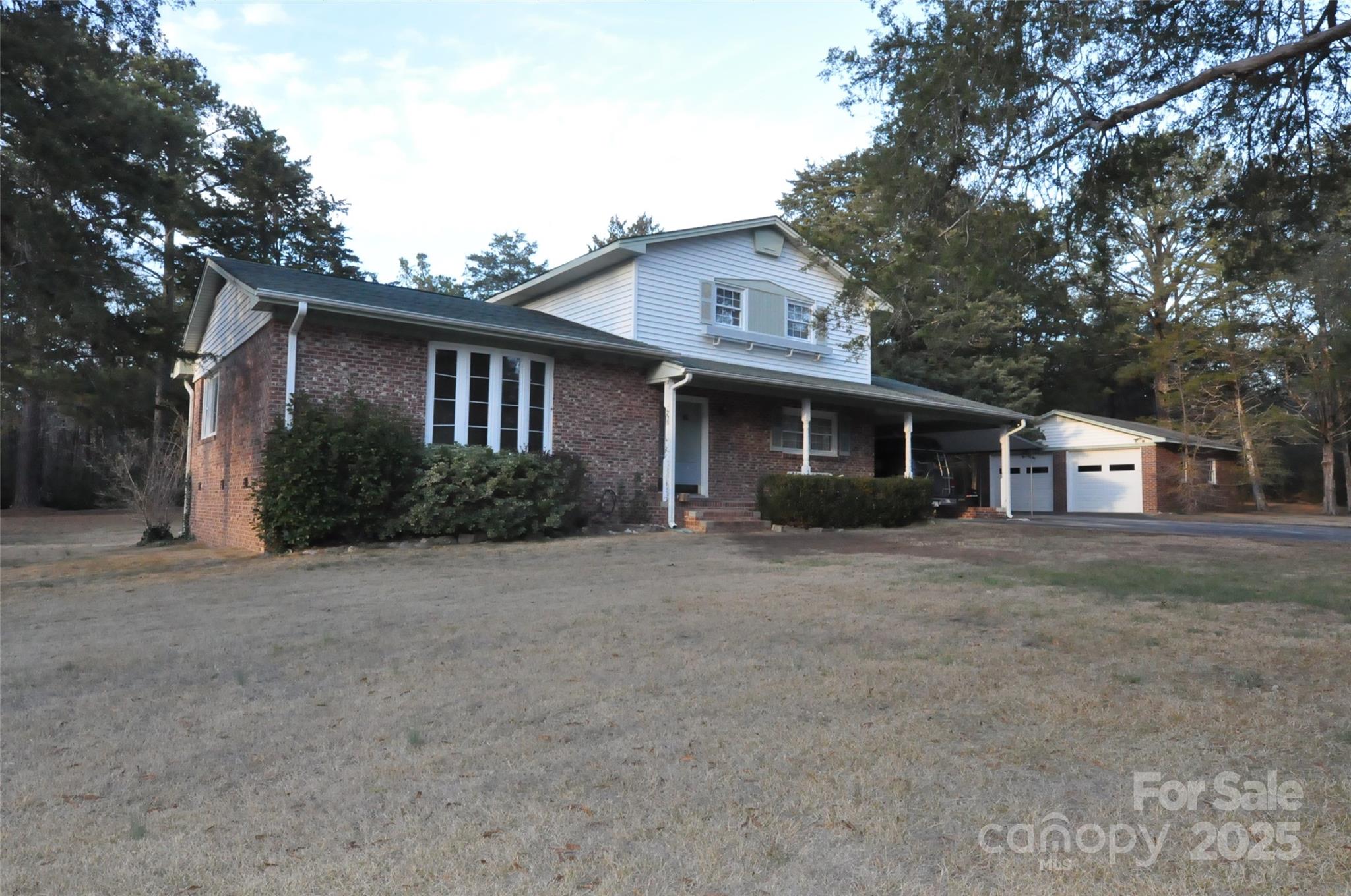752 Cedar Lane Chester, SC 29706 - Photo 34 of 35 a front view of a house with a yard and garage