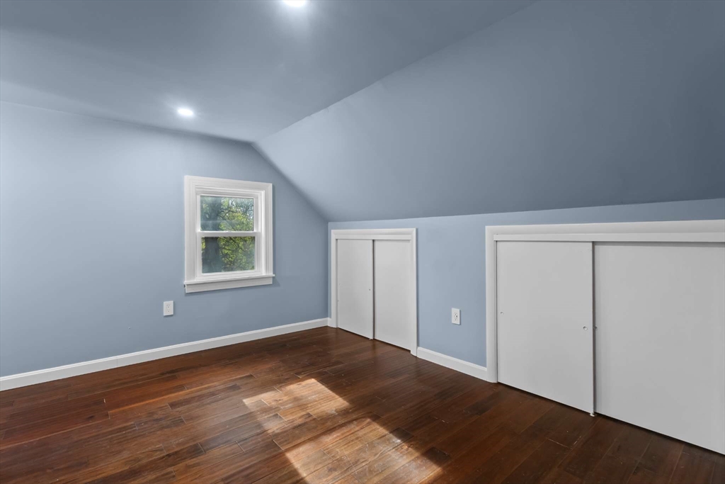 7 Darrow Street Worcester, MA 01606 - Photo 31 of 42 a view of an empty room with wooden floor and a window