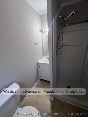 a bathroom with a granite countertop sink a mirror and a bathtub