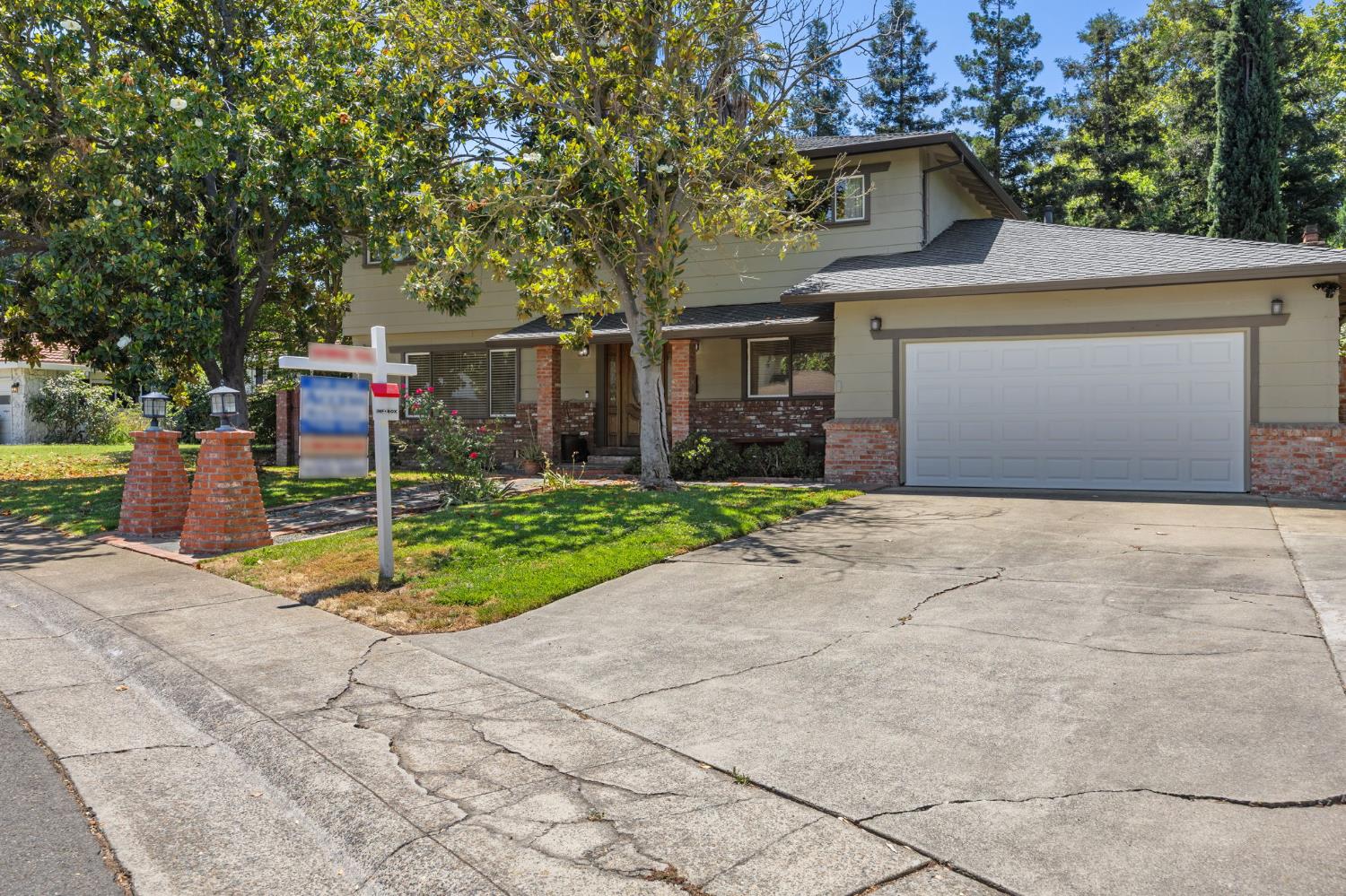 4206 Zephyr Way Sacramento, CA 95821 - Photo 5 of 45 a front view of a house with a yard and garage
