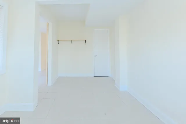 a view of a house with a patio and wooden floor